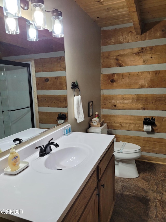 bathroom with vanity, toilet, wooden ceiling, a shower stall, and wooden walls