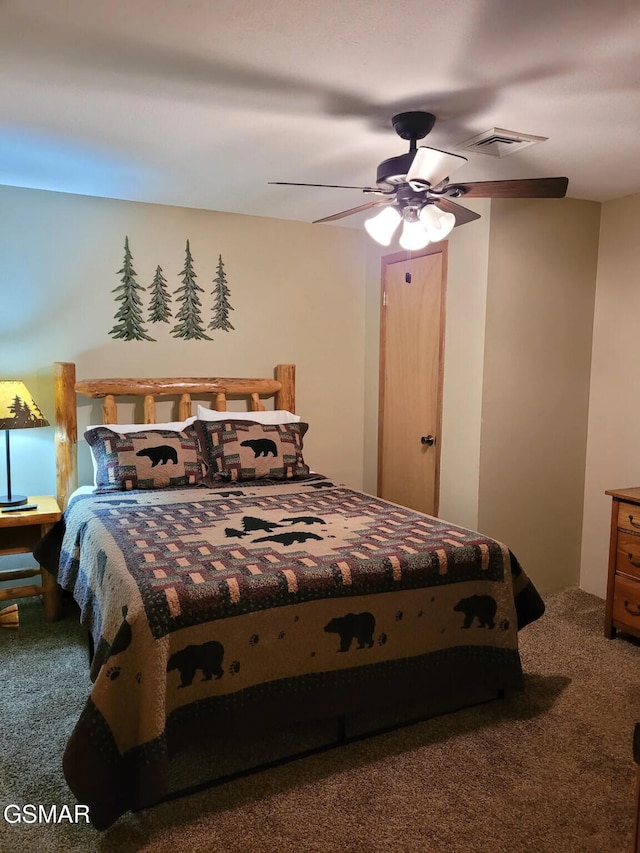 carpeted bedroom with ceiling fan and visible vents