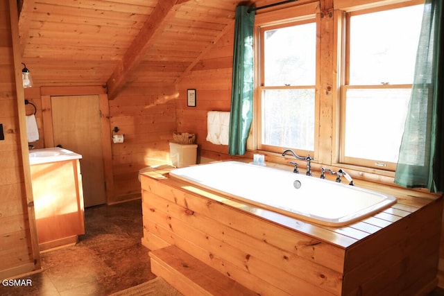 full bath with wood ceiling, vanity, a tub, lofted ceiling with beams, and wooden walls