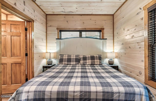 bedroom featuring wooden walls and wood ceiling