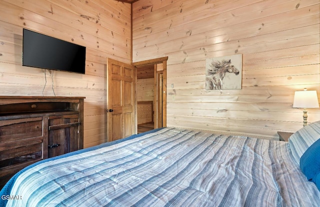 unfurnished bedroom featuring wooden walls