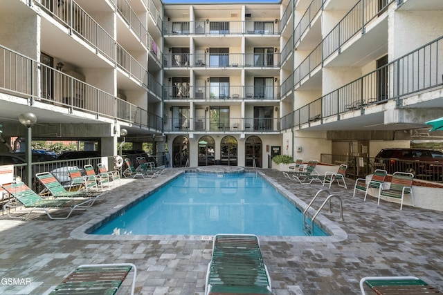 view of swimming pool with a patio