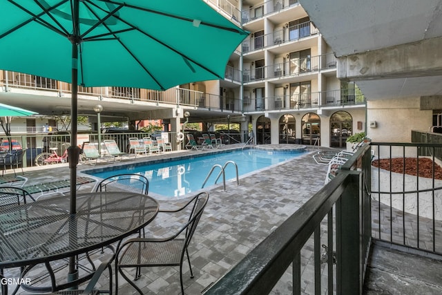 view of pool featuring a patio