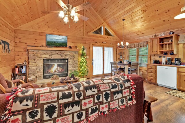 living room with wood ceiling, ceiling fan with notable chandelier, high vaulted ceiling, light hardwood / wood-style floors, and wood walls