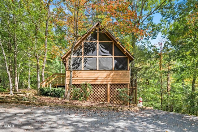 exterior space with a sunroom