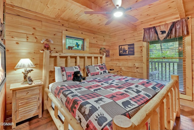 bedroom featuring wood walls, ceiling fan, wooden ceiling, and hardwood / wood-style flooring