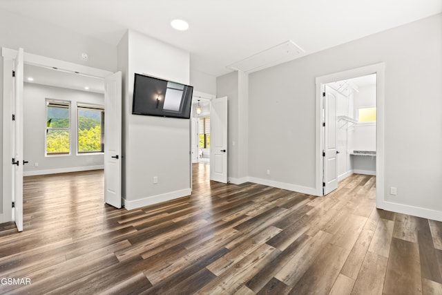 3955 Denton Ct, Sevierville, TN 37862 - unfurnished bedroom featuring attic access, dark wood-type flooring, recessed lighting, and a spacious closet