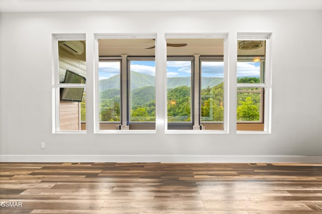 3955 Denton Ct, Sevierville, TN 37862 - empty room featuring wood finished floors and a wall mounted air conditioner