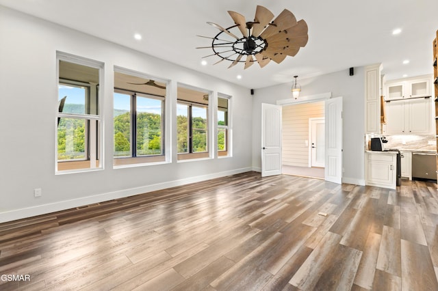 3955 Denton Ct, Sevierville, TN 37862 - unfurnished living room with recessed lighting, wood finished floors, and a ceiling fan