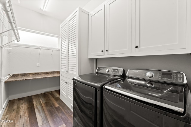 3955 Denton Ct, Sevierville, TN 37862 - laundry room featuring cabinet space, washing machine and dryer, and dark wood-type flooring