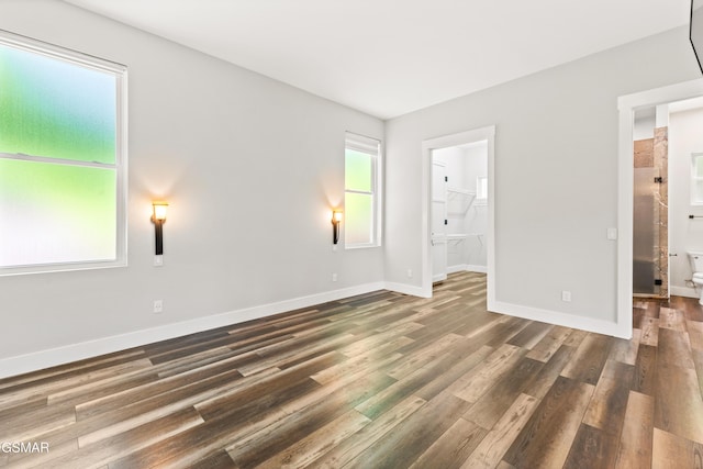 3955 Denton Ct, Sevierville, TN 37862 - unfurnished bedroom with wood finished floors and a walk in closet