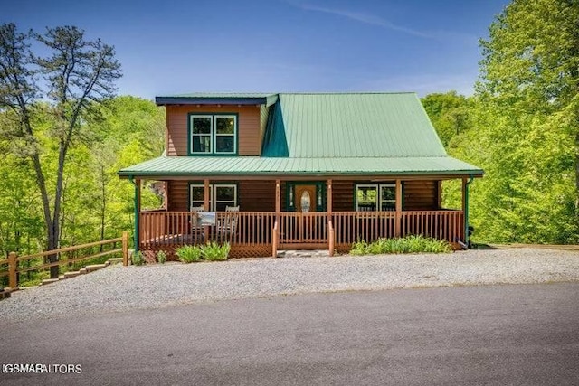 log-style house with a porch