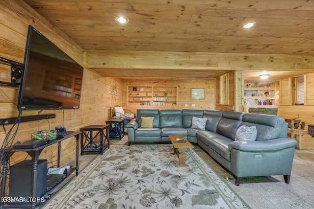 living room featuring built in shelves, wooden walls, and wooden ceiling