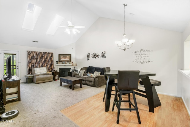1218 Ernest Mcmahan Rd, Sevierville, TN 37862 - dining space with high vaulted ceiling, a chandelier, a skylight, and ceiling fan