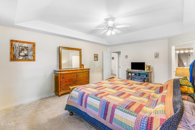 1218 Ernest Mcmahan Rd, Sevierville, TN 37862 - bedroom featuring a tray ceiling, light colored carpet, and a ceiling fan