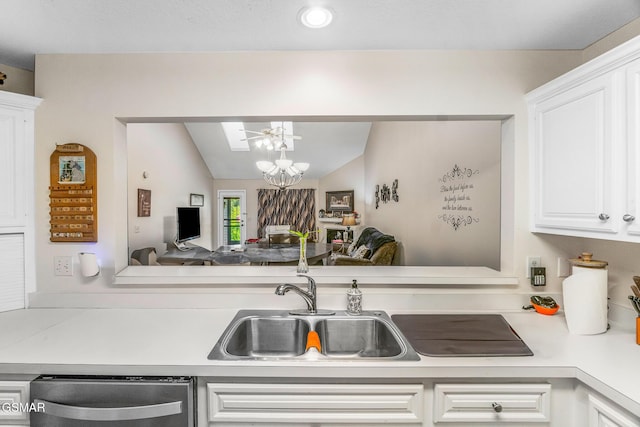 1218 Ernest Mcmahan Rd, Sevierville, TN 37862 - kitchen featuring stainless steel dishwasher, light countertops, vaulted ceiling, white cabinetry, and a chandelier