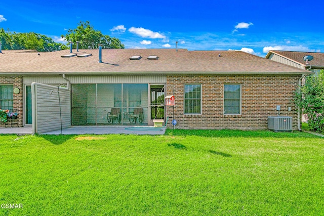 1218 Ernest Mcmahan Rd, Sevierville, TN 37862 - rear view of house featuring a lawn, brick siding, a patio area, and roof with shingles