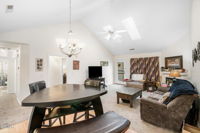 1218 Ernest Mcmahan Rd, Sevierville, TN 37862 - living area featuring high vaulted ceiling, a skylight, light colored carpet, a chandelier, and ceiling fan
