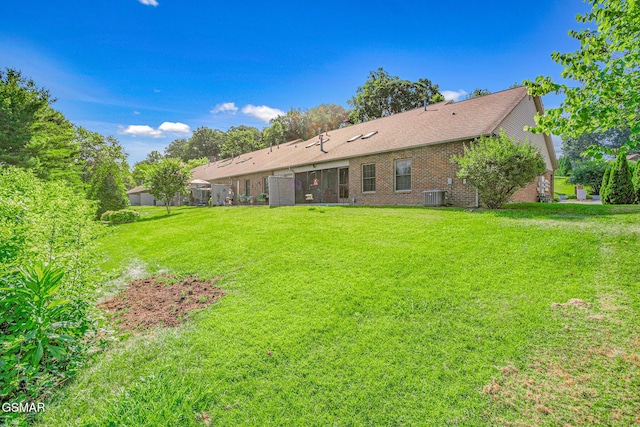1218 Ernest Mcmahan Rd, Sevierville, TN 37862 - rear view of house with a yard, brick siding, and a shingled roof