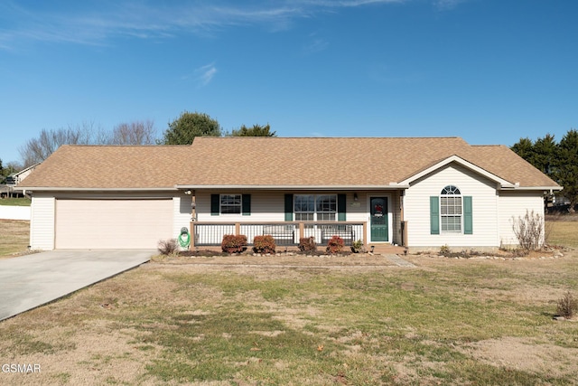 ranch-style home featuring a garage, a front yard, and covered porch