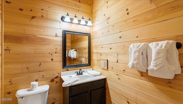 438 Alpine Mountain Way, Pigeon Forge, TN 37863 - half bath with toilet, wood walls, and vanity