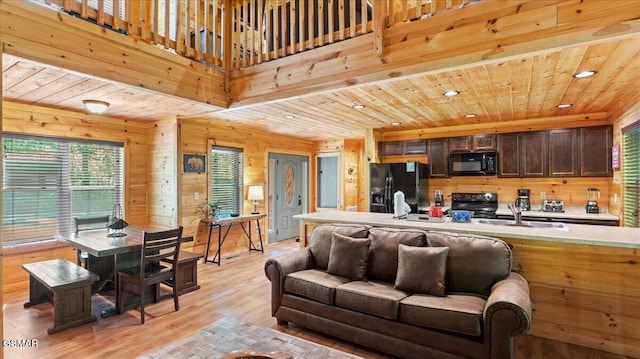 438 Alpine Mountain Way, Pigeon Forge, TN 37863 - living area with light wood-type flooring, wooden ceiling, wood walls, and recessed lighting