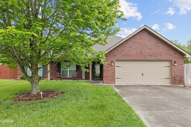 view of front of house with driveway, brick siding, fence, a front lawn, and an attached garage