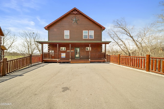 692 Stockton Dr, Sevierville, TN 37876 - back of house with log exterior and a porch