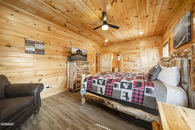 692 Stockton Dr, Sevierville, TN 37876 - bedroom with wooden ceiling, wooden walls, and wood finished floors