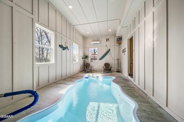 692 Stockton Dr, Sevierville, TN 37876 - indoor pool with a jacuzzi and a wall mounted air conditioner
