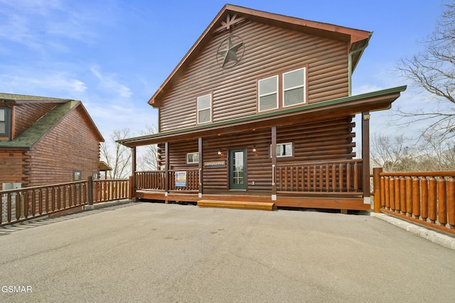 692 Stockton Dr, Sevierville, TN 37876 - rear view of house with covered porch and log exterior