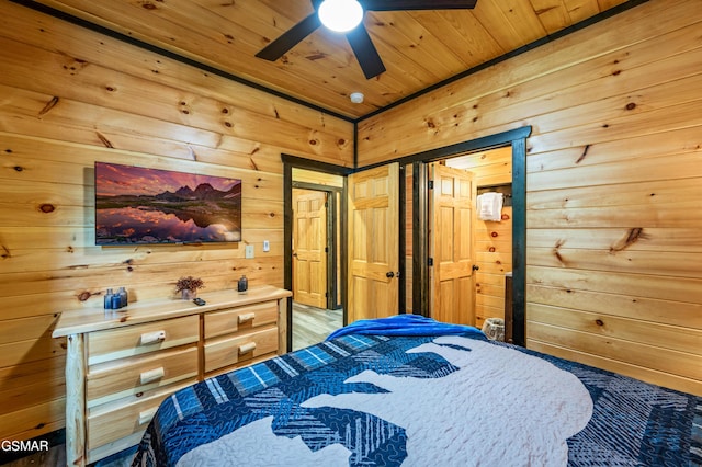 bedroom with wooden walls, ceiling fan, and wooden ceiling