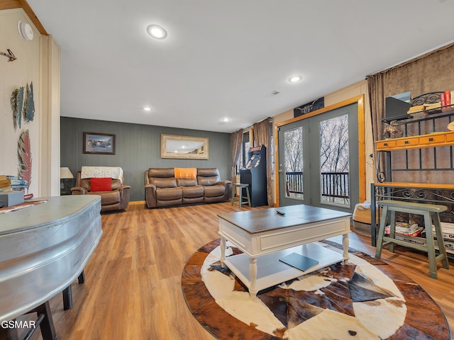 living area featuring french doors, wood finished floors, and recessed lighting