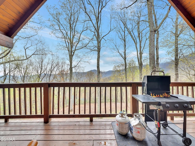 wooden deck with a mountain view