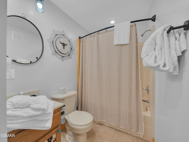full bathroom featuring tile patterned floors, shower / bath combo with shower curtain, visible vents, and toilet