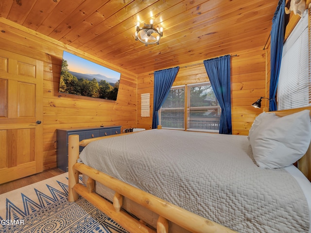 bedroom with wood ceiling, wooden walls, and wood finished floors