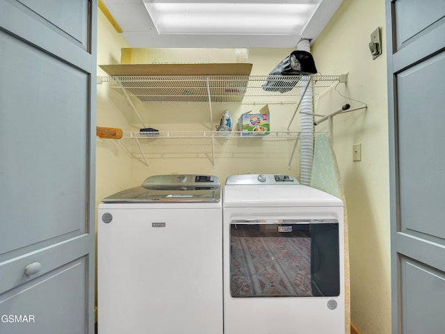 laundry area with separate washer and dryer and laundry area