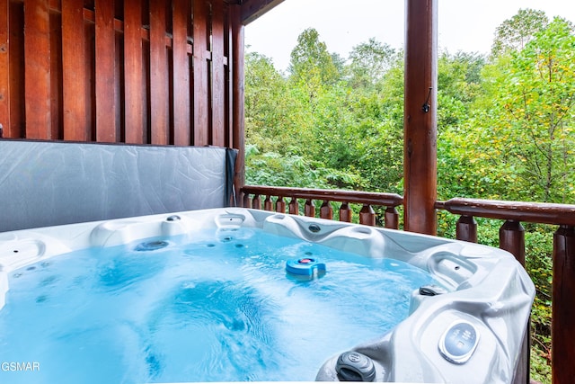 wooden terrace with a hot tub