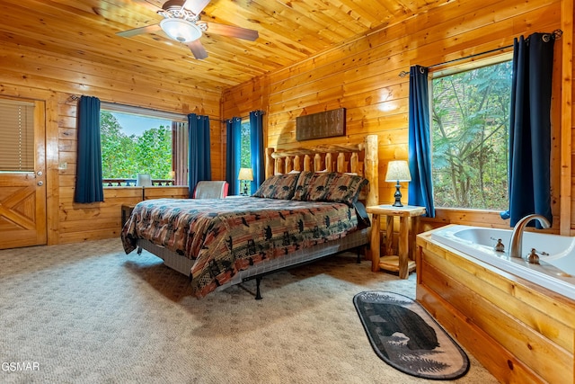 bedroom with light colored carpet, ceiling fan, wooden walls, and wood ceiling