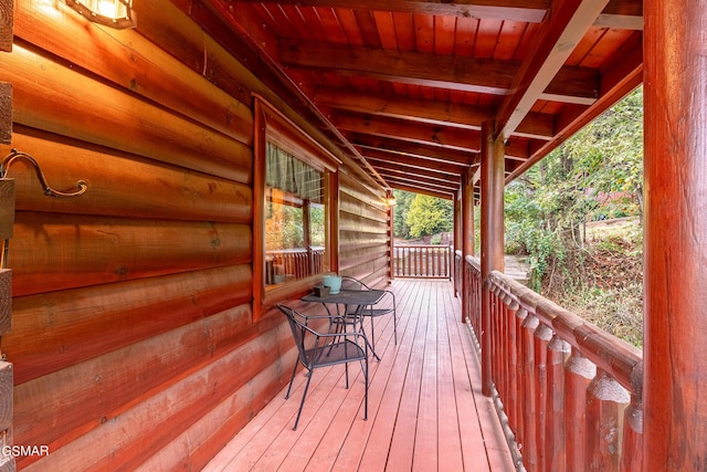 wooden terrace with a porch