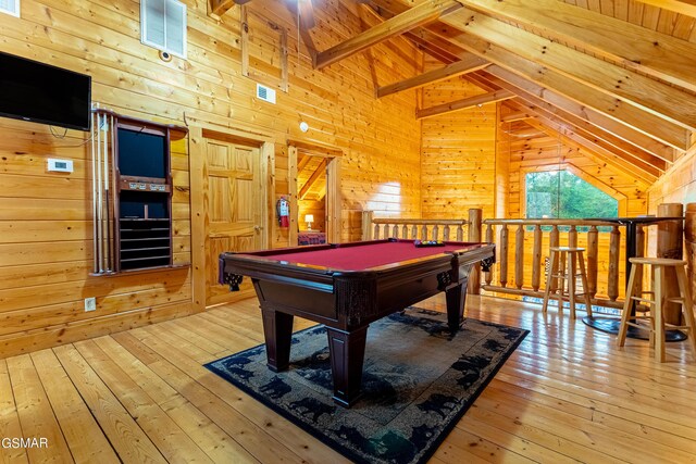 recreation room with beam ceiling, wood walls, light wood-type flooring, and billiards