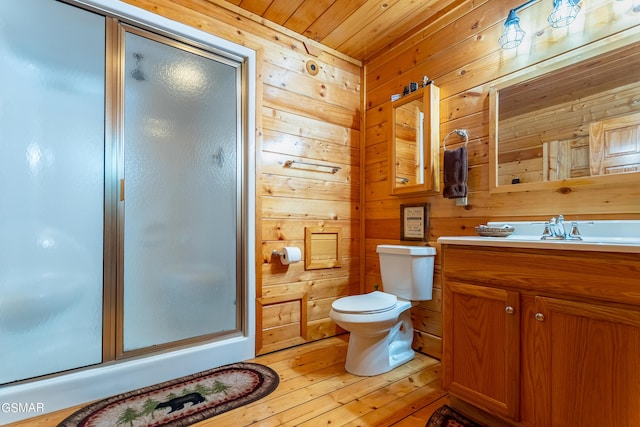 bathroom with walk in shower, wood ceiling, vanity, toilet, and wood walls