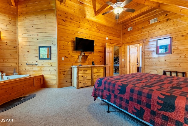 bedroom featuring ceiling fan, beam ceiling, light colored carpet, and high vaulted ceiling