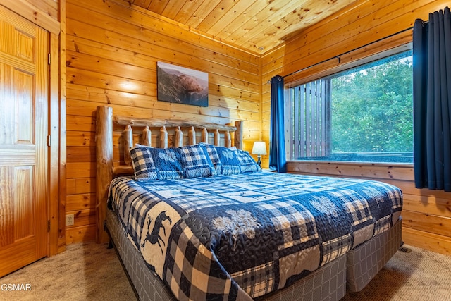 bedroom with carpet, wood walls, and wood ceiling