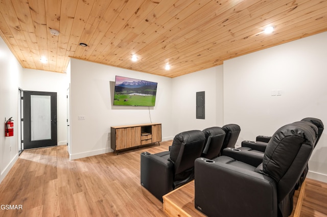 cinema featuring electric panel, wood ceiling, light wood-style flooring, recessed lighting, and baseboards