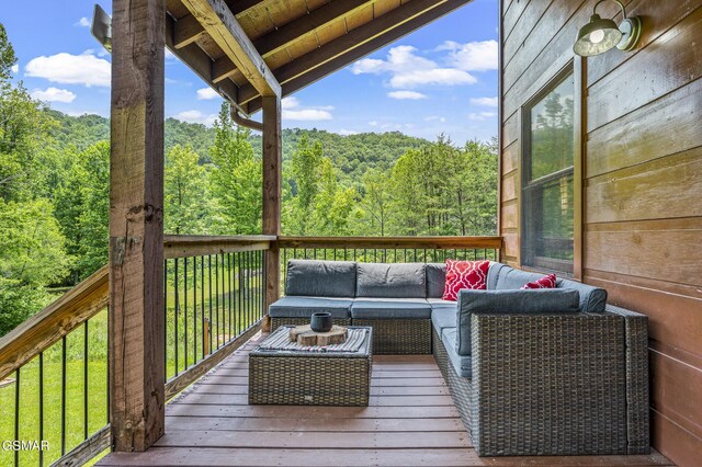 wooden deck featuring outdoor lounge area