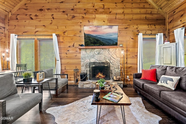 living room with dark hardwood / wood-style flooring, a stone fireplace, wooden walls, and wood ceiling