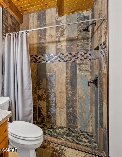 bathroom with vanity, toilet, curtained shower, and wood ceiling