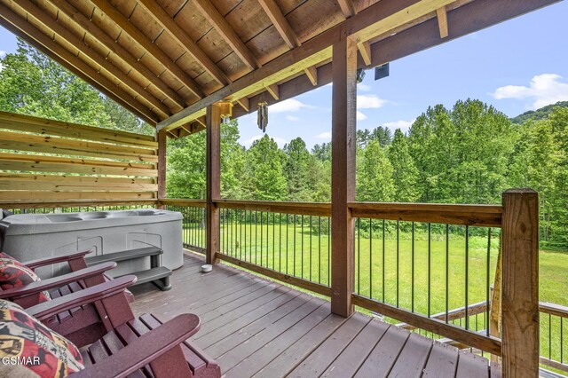 wooden terrace with a lawn