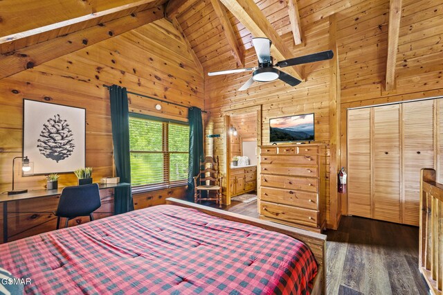 bedroom featuring wooden ceiling, dark wood-type flooring, ceiling fan, beamed ceiling, and a closet